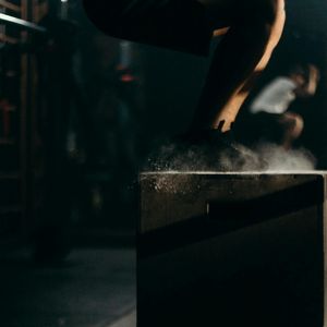 Abstract motion blur of a person jumping during cardio.