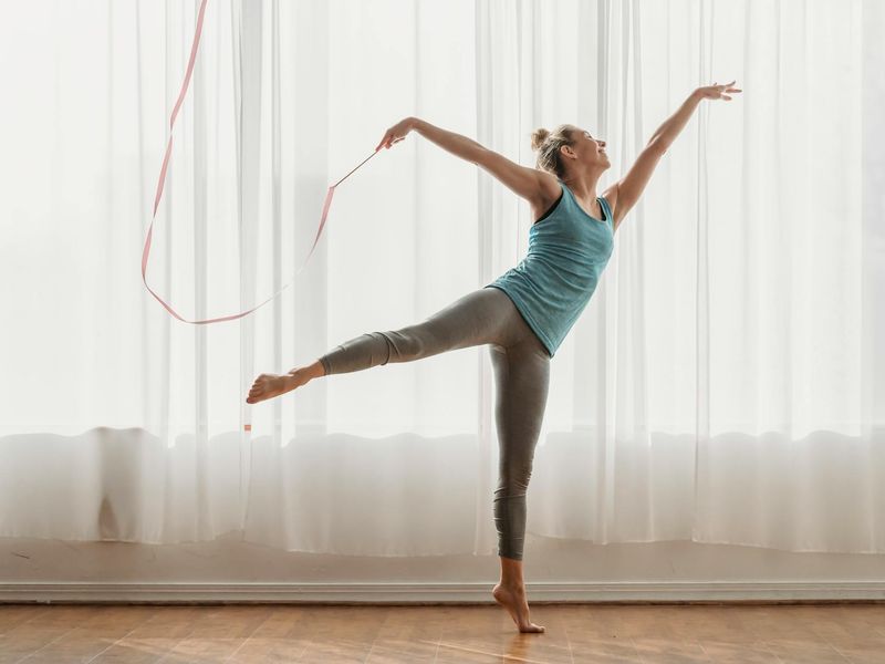 Athletic person performing a rhythmic cardio exercise sequence.